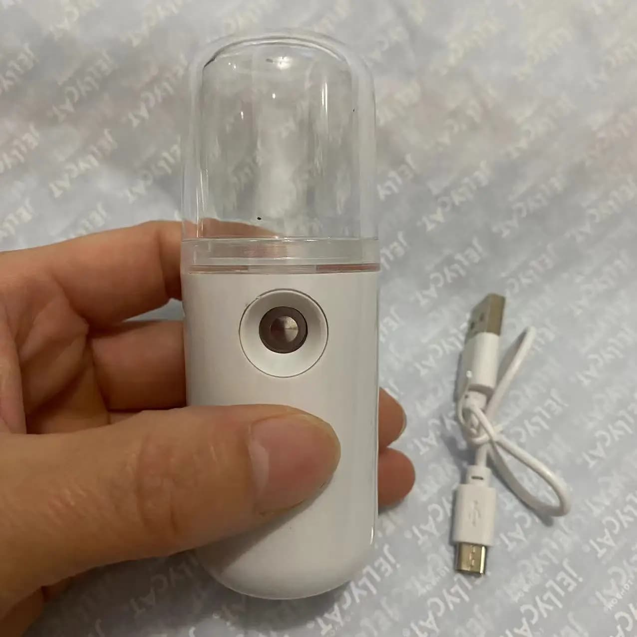 compact rechargeable facial steamer emitting nano mist — image 7