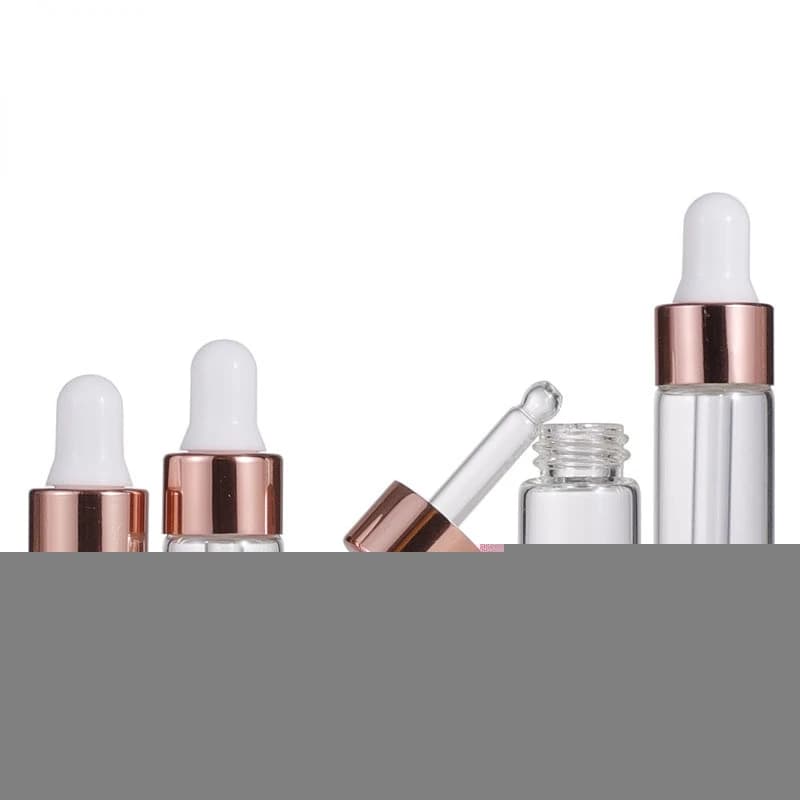 set of ten mini glass dropper bottles with rose gold caps — image 3