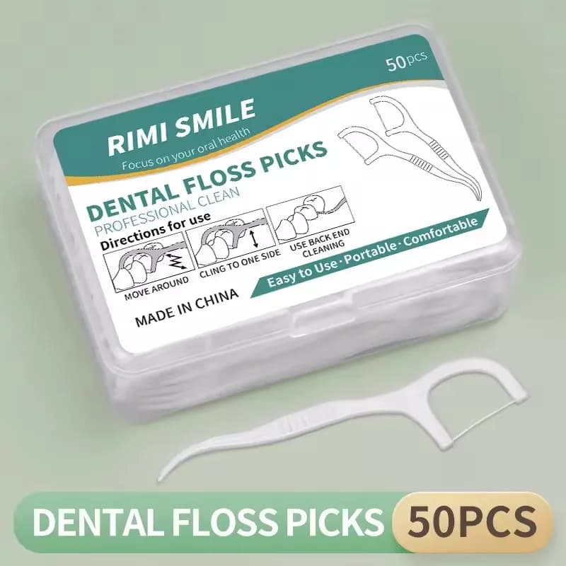Disposable plastic dental floss sticks in a box — image 7