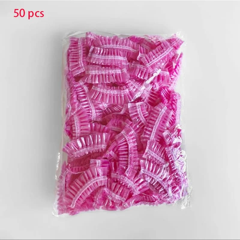 Disposable plastic shower hair caps in pink — image 7
