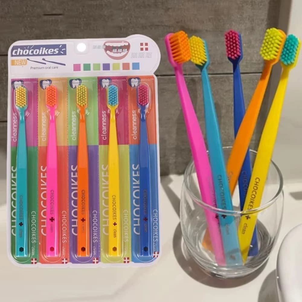 Five soft pastel toothbrushes in a travel case — image 2