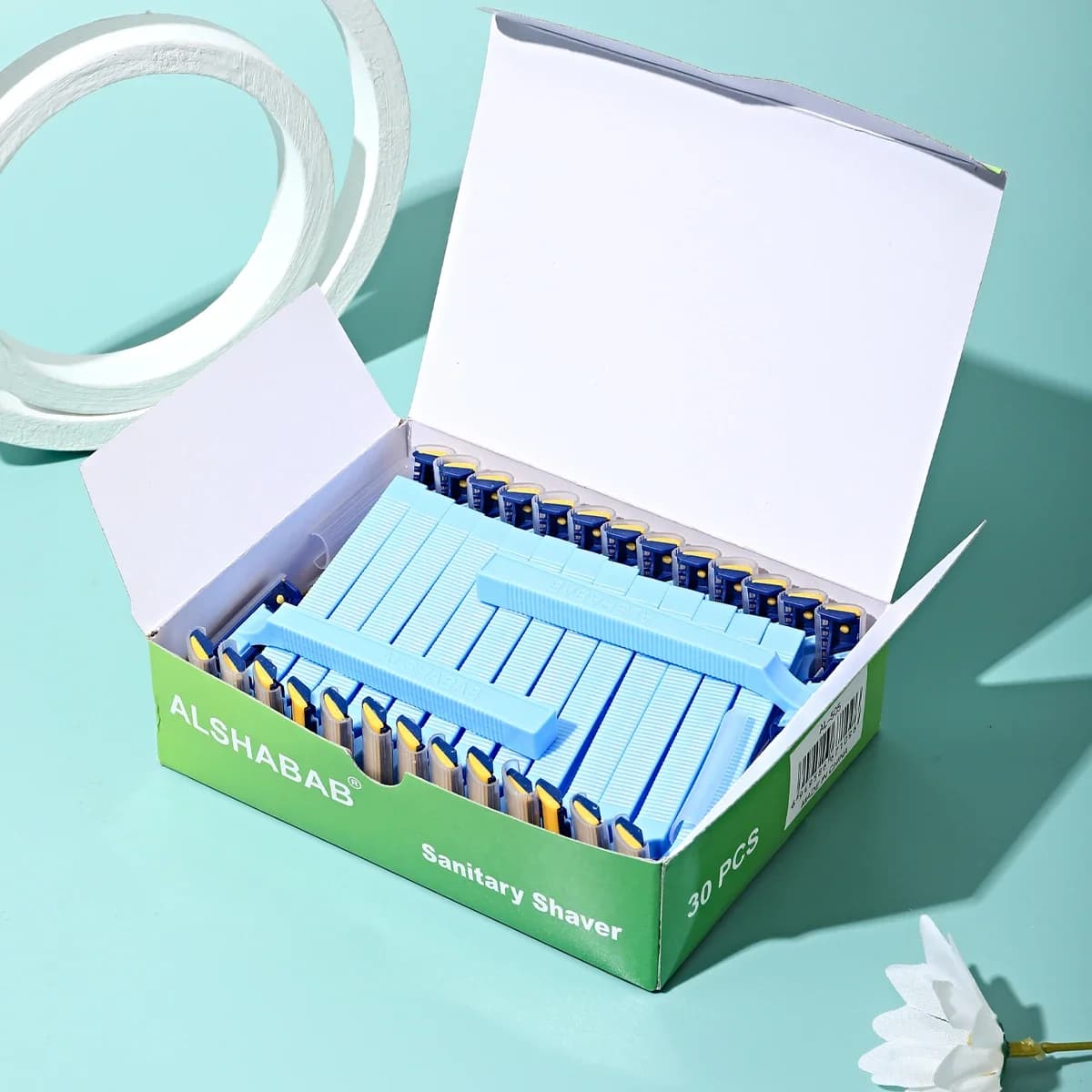 Box of 30 disposable women's razors with comb head — image 3