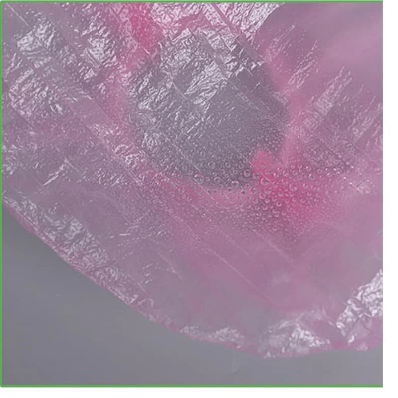 Disposable plastic shower hair caps in pink — image 3