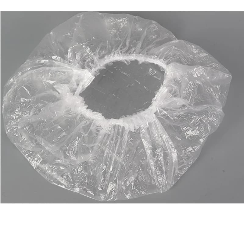 Disposable plastic shower hair caps in pink — image 6