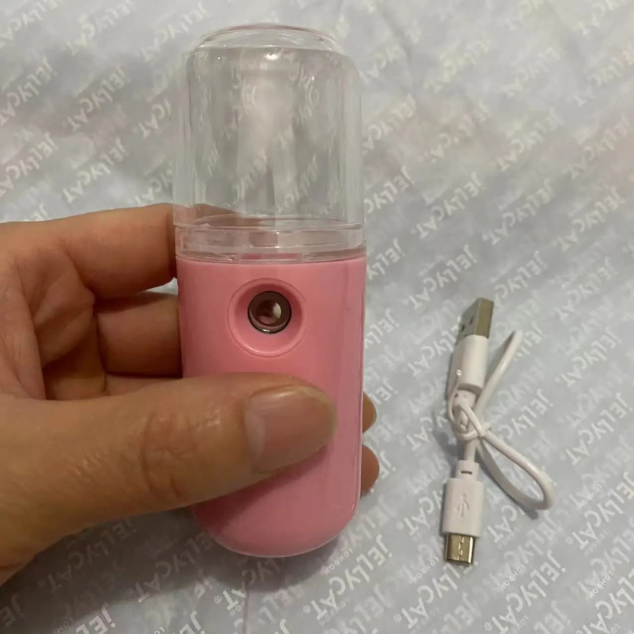 compact rechargeable facial steamer emitting nano mist — image 8