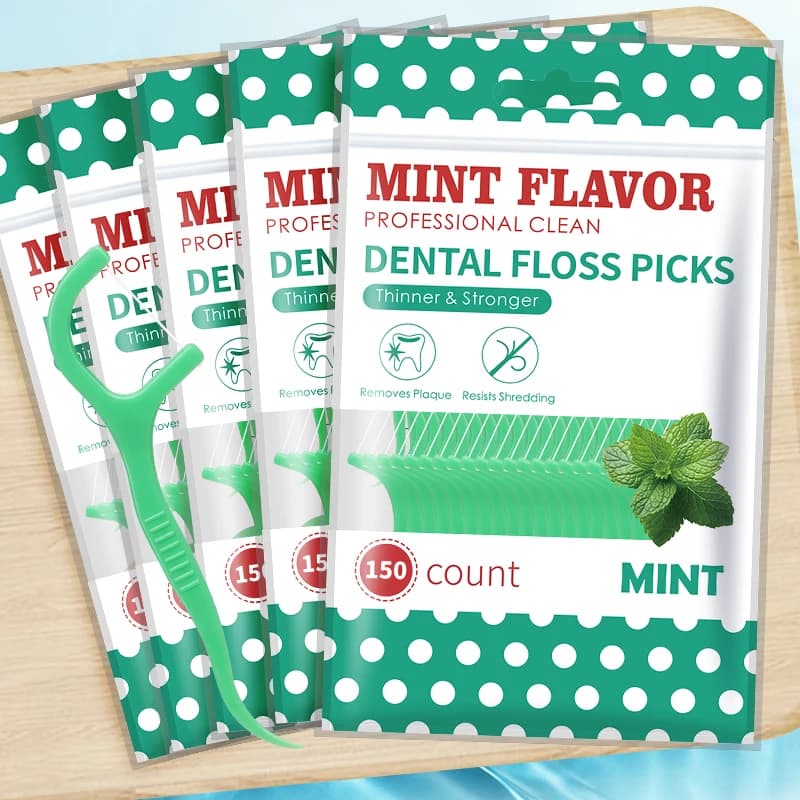 Mint-flavored disposable floss cleaning sticks — image 1