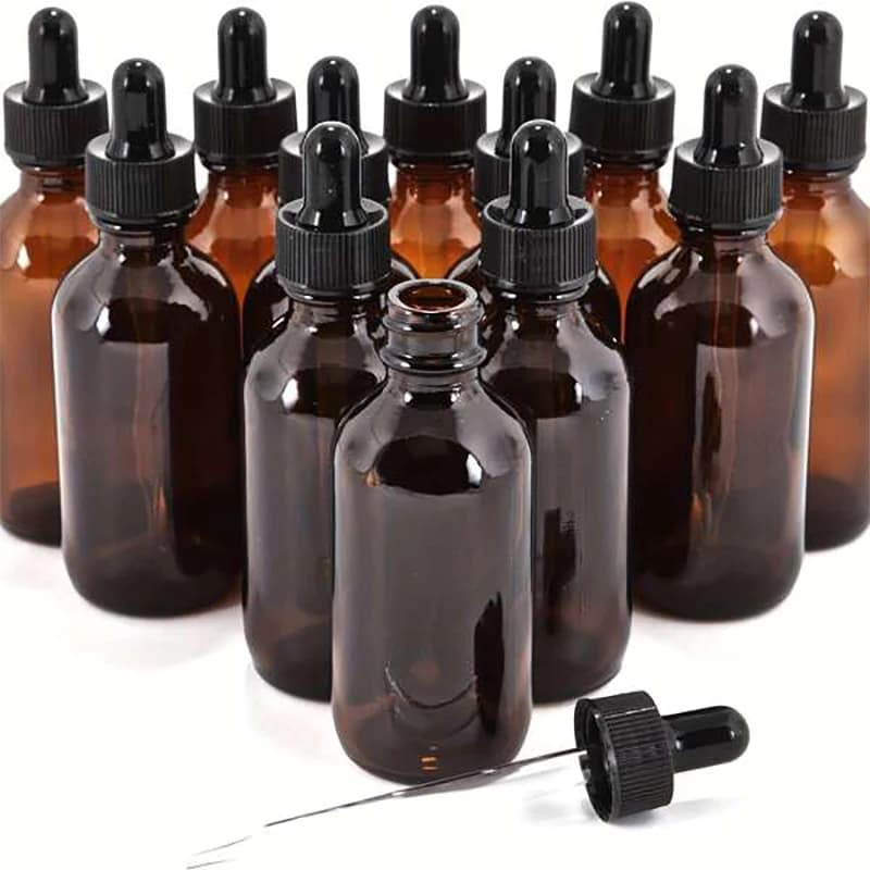 Set of 12 amber glass 30ml essential oil bottles with droppers — image 1